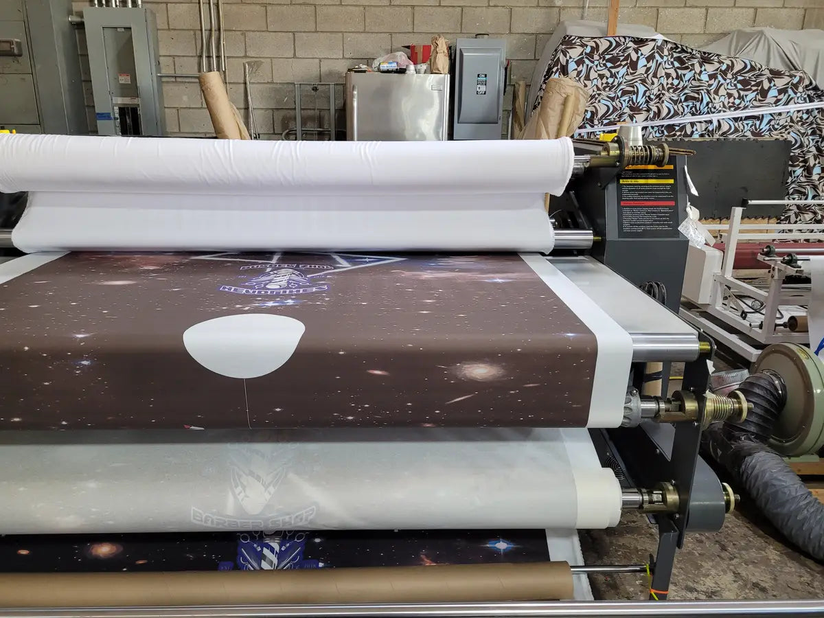 Sublimation printer producing full-color transfer artwork for polyester apparel